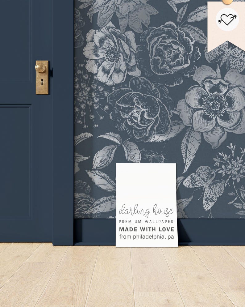 May include: A white card with the text "darling house PREMIUM WALLPAPER MADE WITH LOVE from philadelphia, pa" on a blue background with a floral pattern.