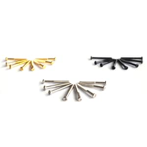May include: A close-up of three sets of screws, each in a different colour: gold, silver, and black. The screws are arranged in a semi-circle pattern on a white background.