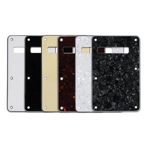 May include: Six guitar back plates in different colors and patterns. The plates are made of plastic and have a smooth finish. The colors are white, black, cream, tortoise shell, white pearl, and black pearl.