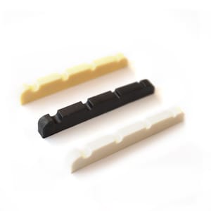 Può includere: Tre selle per ponte di chitarra, una bianca, una nera e una color crema.