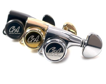 May include: Three guitar tuning pegs in black, gold, and chrome finishes. Each peg features a silver logo that reads "Guitar Anatomy".