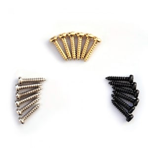 May include: A set of screws in three different finishes: gold, silver, and black. The screws are arranged in a triangular pattern on a white background.