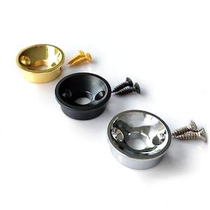 May include: Three guitar output jack plates, one gold, one black and one chrome.