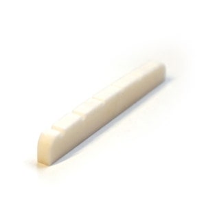 May include: White plastic guitar bridge saddle with six grooves for strings.
