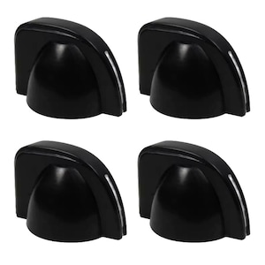 May include: Four black plastic knobs with a rounded top and a raised edge around the perimeter. The knobs have a silver trim around the edge.