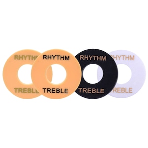 Könnte beinhalten: Vier Gitarrenknopf-Abdeckungen in verschiedenen Farben: Orange, Schwarz, Weiß und Orange. Die Knöpfe haben die Aufschriften "Rhythm" und "Treble" aufgedruckt.
