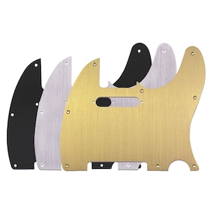 Puede incluir: Tres placas de protección para guitarra en negro, plata y oro. Las placas de protección están hechas de metal y tienen un acabado cepillado.