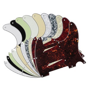 Può includere: Un set di dieci battipenna per chitarra in vari colori e motivi, tra cui nero, bianco, crema, verde e tartaruga.