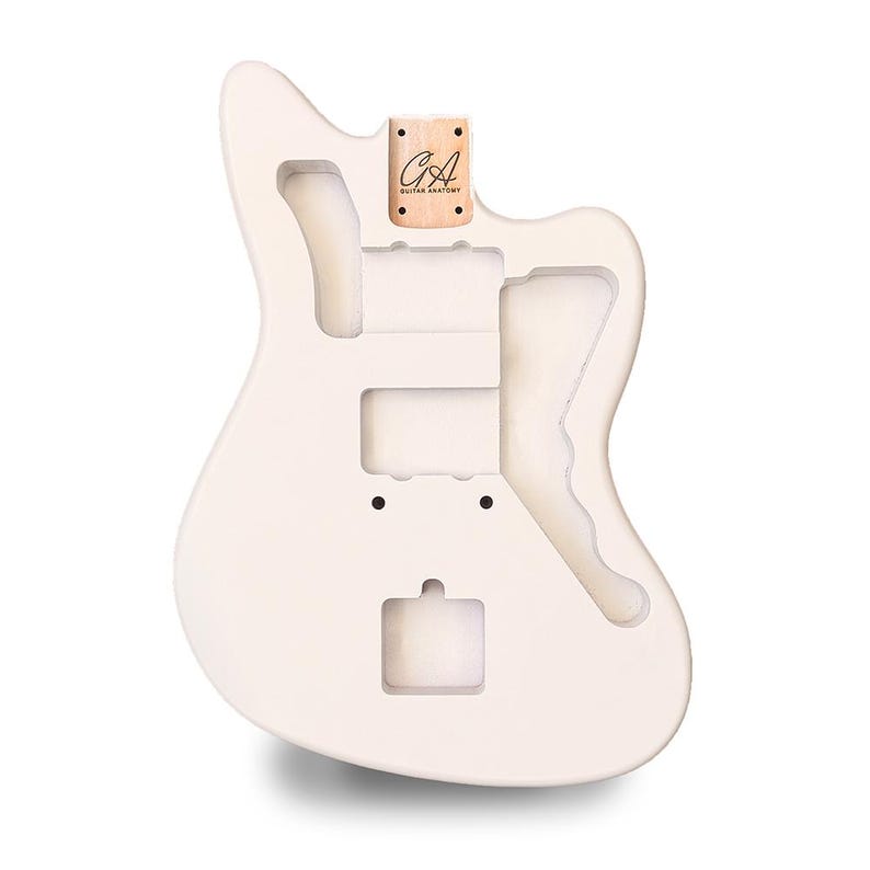 May include: A white guitar body with cutouts for pickups, controls, and a tremolo system. A small wooden piece with the text "GA Guitar Anatomy" is attached to the top. The body has a smooth, matte finish.