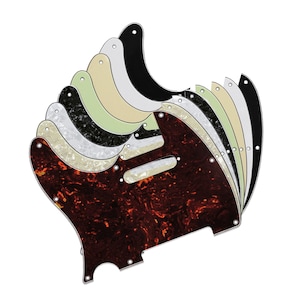 May include: A set of ten guitar pickguards in various colours and patterns, including black, white, cream, green, and tortoiseshell.