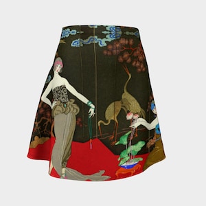 May include: A black, red, and green skirt with a print of two women and a crane. The women are wearing elaborate dresses and are holding flowers. The crane is standing on a red platform.