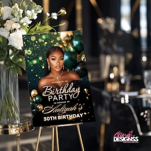 May include: A welcome sign for a birthday party, featuring a woman with dark hair and a black dress. The sign reads "Welcome to the Birthday Party in Honour of Haliyah's 30th Birthday" with gold and green accents and balloons.