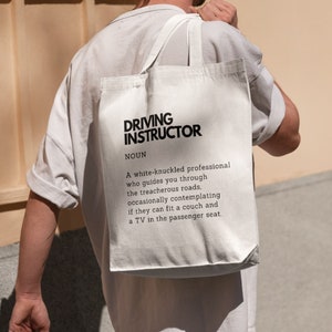 Definitie van rij-instructeur gedrukte grappige draagtas katoenen tas rijden liefhebber cadeau voor rij-instructeur draagtas met grappige definitie