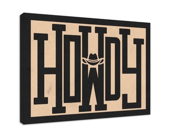 May include: A black and white graphic print of the word "Howdy" with a cowboy hat over the "O". The print is on a beige background and framed with a black border.