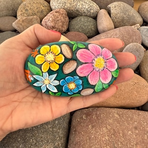 Bright Flowers Hand Painted on Oblong River Rock. Teal background. Stone by Val