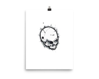 Puede incluir: Una ilustración en blanco y negro de una calavera con tinta salpicada alrededor.