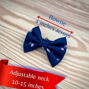 May include: A navy blue bow tie with a white star and red, white, and blue American flag pattern. The bow tie measures 4 inches across and has an adjustable neck size of 10-15 inches.