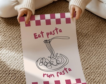 May include: A white poster with a pink checkered border and the words "Eat pasta run fasta" in pink script. A black line drawing of pasta being lifted by a fork is in the center of the poster.