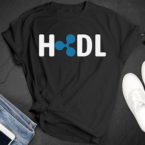 May include: Black t-shirt with white text that reads "HODL" and a blue ripple logo.