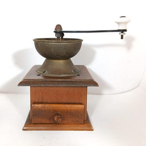 May include: A set of three ceramic mugs with a speckled, matte finish. Each mug features a different color: light blue, cream, and gray. The mugs have a simple, modern design and a comfortable handle. Perfect for coffee or tea.