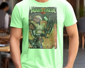 May include: A light green t-shirt featuring a vintage comic book cover design. The graphic, titled "Mars Saga," depicts a futuristic soldier with a weapon. The design has a distressed, aged appearance, with a price tag visible.