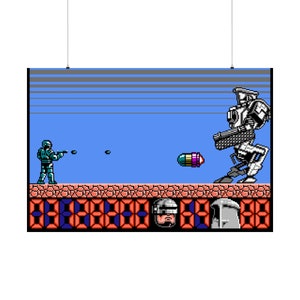 May include: A pixelated video game scene with a blue background. A green and blue character is shooting at a large, white robot. The robot is firing back with a pink and purple bullet. The scene is set on a red and brown platform with a digital display.