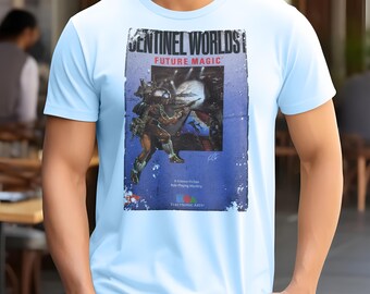 May include: Light blue t-shirt featuring a vintage-style graphic from "Sentinel Worlds: Future Magic." The design includes a science fiction scene with a soldier and the Electronic Arts logo. The shirt is made of a soft material.