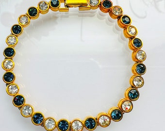 Vintage Costume Bracelet With Blue Sapphire rhinestones. D'Orlan sign bracelet. 1960's