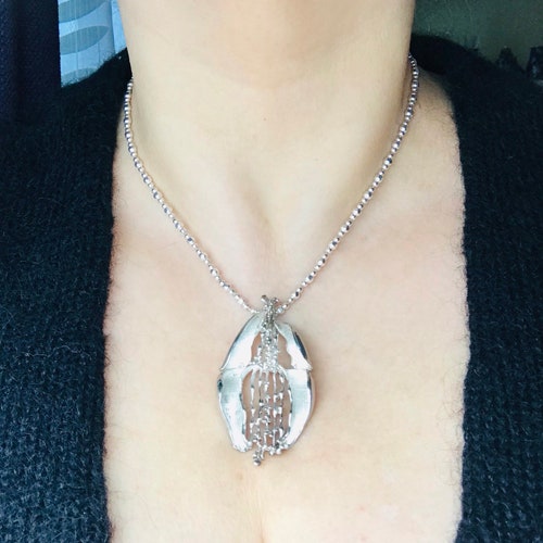 Shops Modernist silver pendant on a chain. 60's.