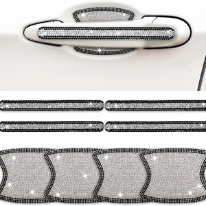 May include: A set of car door handle covers and trim pieces. The covers and trim are embellished with sparkling rhinestones. The door handle covers are black and silver, and the trim pieces are long, rectangular, and also black and silver.