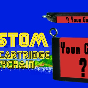 May include: Custom Sega cartridge keychain with a red label that says "Your Game?" in black text. The keychain is black with a silver ring.