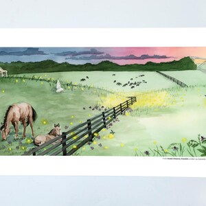 May include: Watercolor landscape print featuring a horse grazing in a field with a second horse resting nearby. A fence, a house, and a bridge are in the background. The sky transitions from pink to blue, with fireflies illuminating the scene.