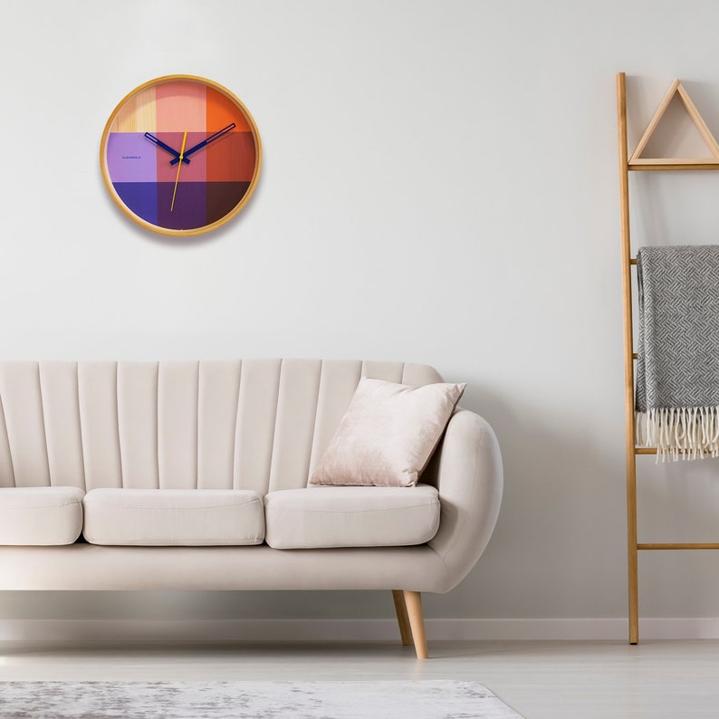 An art piece and timepiece in one. The red Flor wall clock is warm and welcoming, yet modern and minimal, all at the same time. Solid natural wood frame. Pop of color via the vibrant printed face and contrasting hands. The definition of Dutch design.