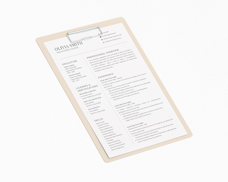 May include: A beige clipboard with a silver clip holding a resume. The resume is white with black text, including the name "OLIVIA SMITH REGISTERED NURSE". The clipboard is angled, with the text clearly visible.