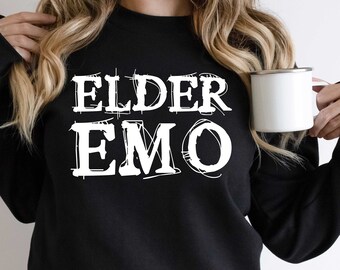 May include: Black sweatshirt with white text that reads "ELDER EMO" in a handwritten style.