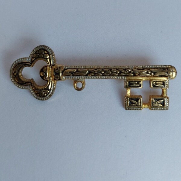 Vintage key brooch, elegant lapel pin.