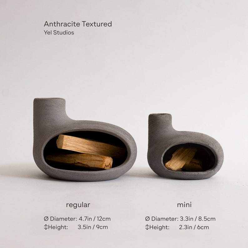 May include: Two gray ceramic incense holders, one larger and one smaller, with a textured finish. The larger holder is labeled "regular" and measures 4.7 inches in diameter and 3.5 inches in height. The smaller holder is labeled "mini" and measures 3.3 inches in diameter and 2.3 inches in height.