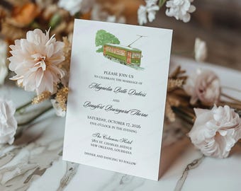 May include: A wedding invitation with a watercolour illustration of a green and red tram. The invitation includes the names Magnolia Belle Dubois and Beaufort Beauregard Thorne, with event details.