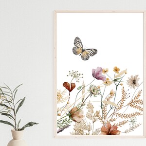 May include: A watercolor painting of a butterfly flying over a bouquet of wildflowers. The flowers are in shades of pink, brown, and white, and the butterfly is yellow and black.