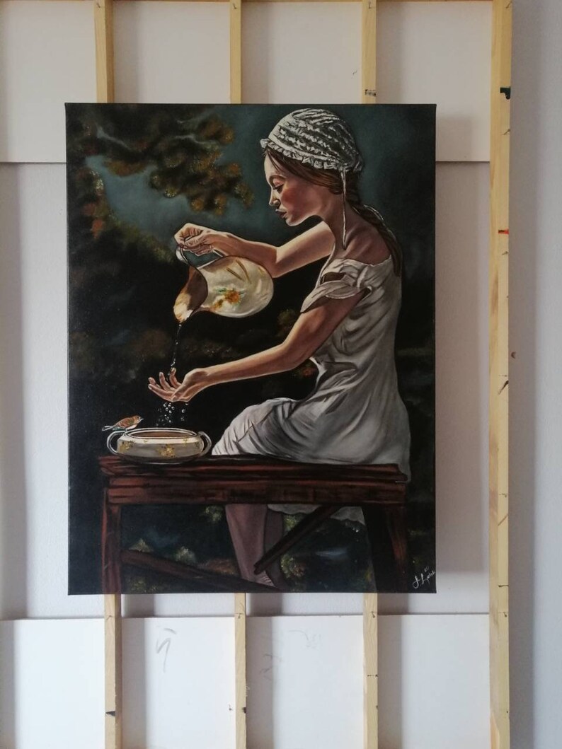 May include: A painting of a woman in a white dress and bonnet pouring water from a pitcher into a bowl. The woman is sitting on a wooden stool in a forest setting. The painting is done in a realistic style with a focus on detail.