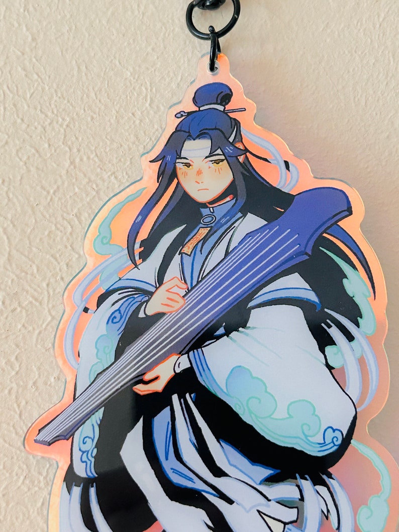 May include: A blue and white anime character with long black hair playing a stringed instrument. The character is wearing a white robe with blue clouds and a blue headband. The background is a gradient of orange and pink.