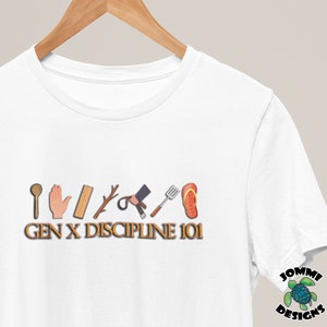 May include: White t-shirt with a graphic of various objects, including a wooden spoon, a hand, a ruler, a stick, a pair of scissors, a spatula, and a flip-flop. The text "GEN X DISCIPLINE 101" is printed below the graphic.