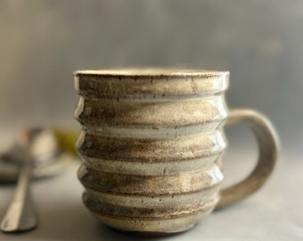 Handmade 10oz mug ceramic rustic off-white with speckled clay and modern ridges. Made on pottery wheel. Non-toxic, lead-free. Free shipping