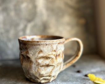 Handmade mug, toasted almond and rootbeer brown glaze, opalesque textured highlights, 10oz. Lead-free, non-toxic. Thrown on a pottery wheel.