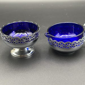 Vintage cobalt blue glass-lined silver-plated cream and sugar set made in England