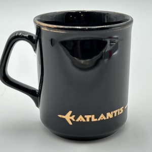 Vintage Atlantis Airlines black ceramic coffee mug