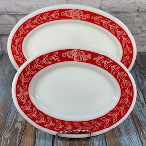 Vintage set of two Pyrex oval serving plates with red leaf and flower design