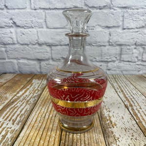 Vintage red and gold striped glass decanter with glass stopper