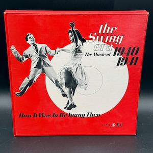 May include: A red box featuring a black and white image of a dancing couple. The text on the box reads "The Swing Era 1940-1941" and "How It Was To Be Young Then". The Time Life Records logo is visible.