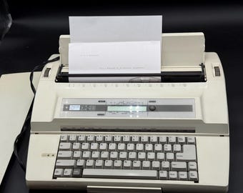 Vintage 1980s Nakajima AX-90 electronic typewriter with carry case, works